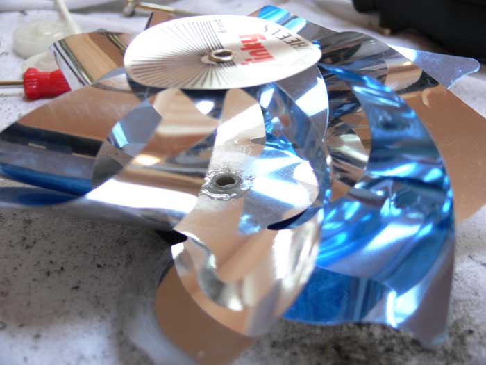 Pinwheel fan with a mass of epoxy spread around the center of the plastic cylindrical piece of the main gear