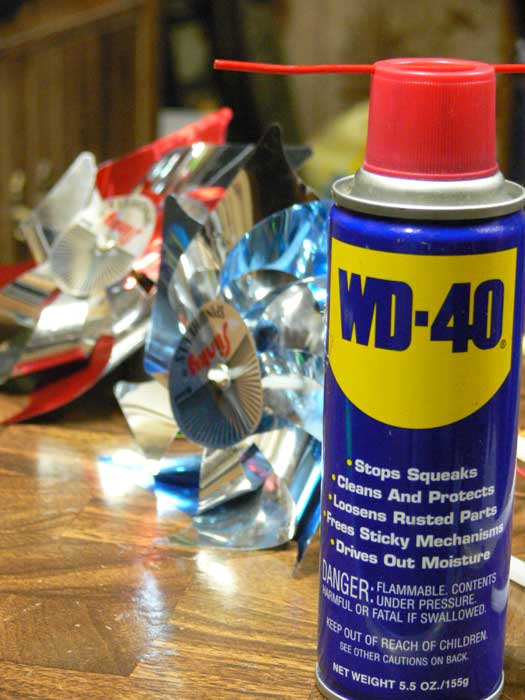 WD-40 on the right with sparkling LED pinwheels trailing off to the left